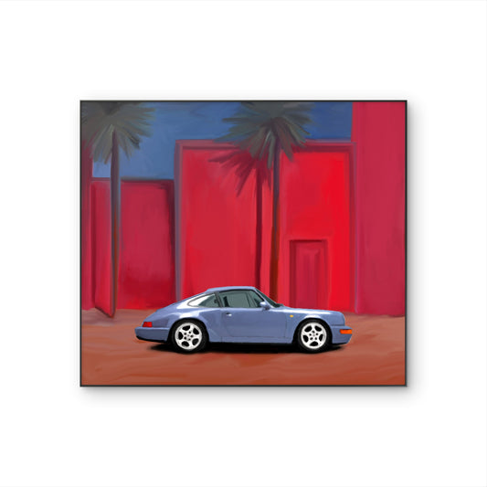 Tableau figuratif contemporain Palm Drive avec voiture sportive bleue devant une architecture rouge et des palmiers.